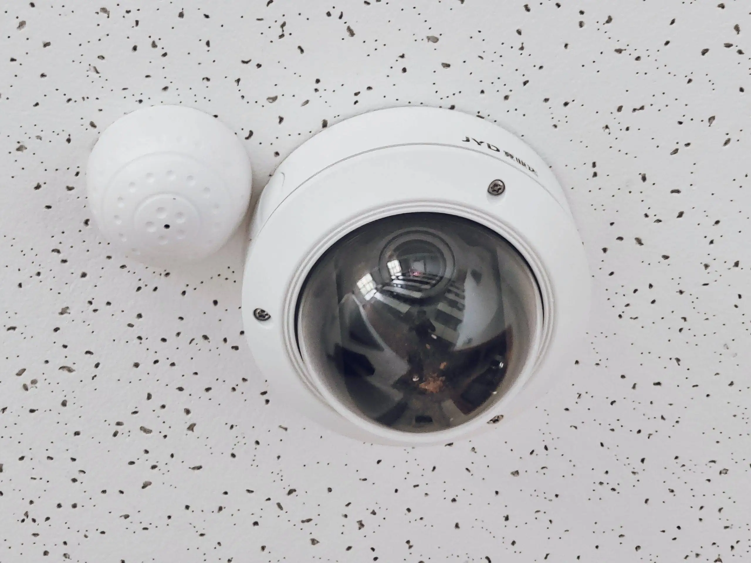 Dome security camera on ceiling